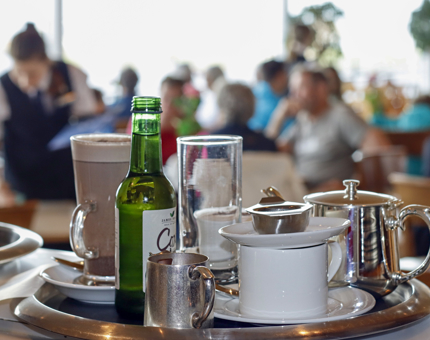 A tray of drinks within the Royal Deck Tearoom at Britannia.
