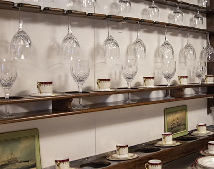 Inside view of The China and Glass Pantry where each glass is stowed in its own special compartment.